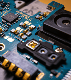 Disassembled mobile phone or smartphone without a back cover, circuit board, microcircuit, slots for sim cards. (C) Shutterstock, Ivan Marc